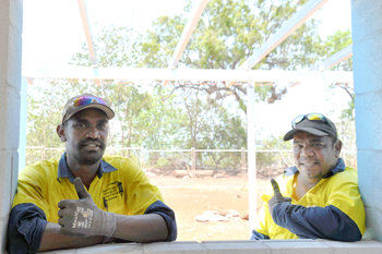 Local Aboriginal workers Shaun Morris and Garth Malwurjc Doolan are currently working to construct a duplex in Maningrida as part of the HomeBuild NT program. 