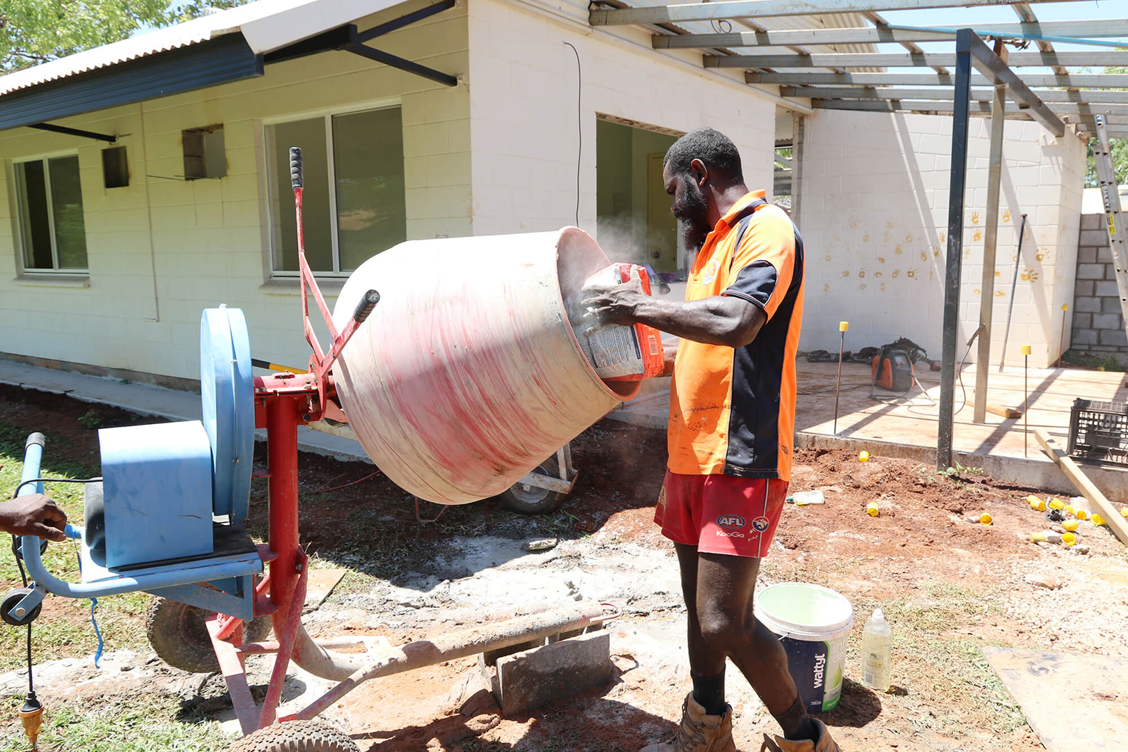Mixing cement on building site.