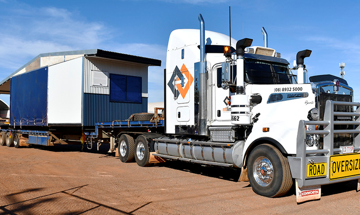 Prefabricated homes on truck ready to leave NT Link yard.