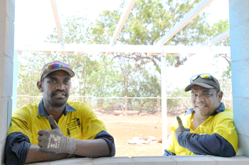 Local Aboriginal workers Shaun Morris and Garth Malwurjc Doolan are currently working to construct a duplex in Maningrida as part of the HomeBuild NT program.