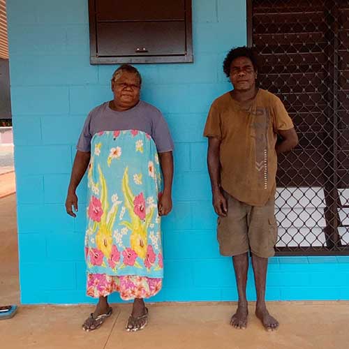Indra and Alvin outside their new house